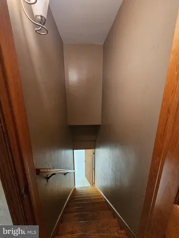 a room with a washing machine and storage