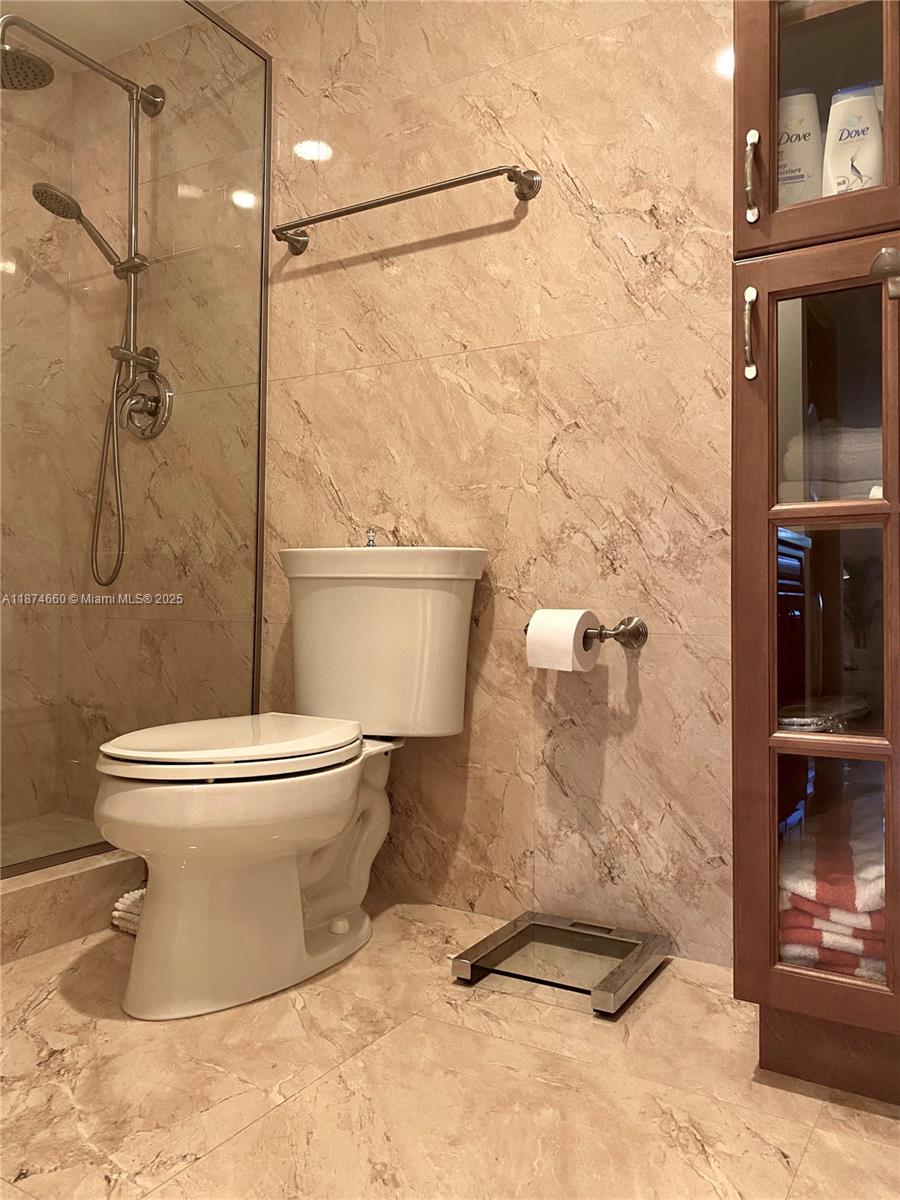 177 Ocean Ln Drive, Unit 212 Key Biscayne, FL 33149 - Photo 13 of 20 a bathroom with a toilet and a shower