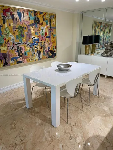 a view of a dining table and chairs