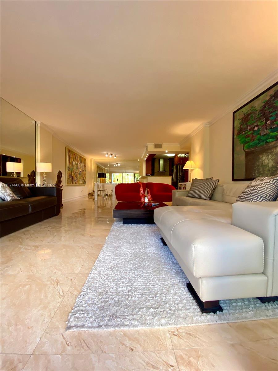 177 Ocean Ln Drive, Unit 212 Key Biscayne, FL 33149 - Photo 17 of 20 a living room with furniture and a flat screen tv