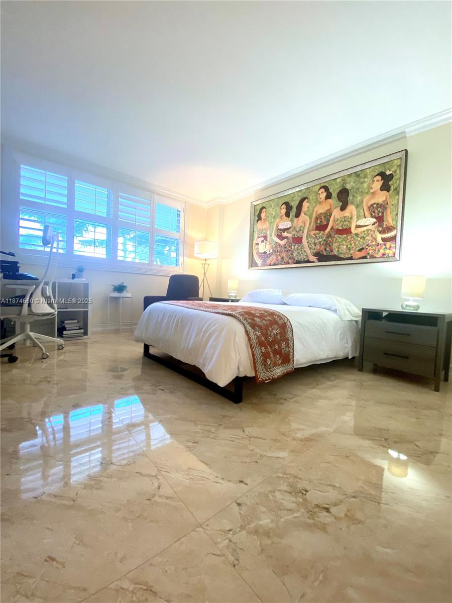 177 Ocean Ln Drive, Unit 212 Key Biscayne, FL 33149 - Photo 4 of 20 a spacious bedroom with a bed and window