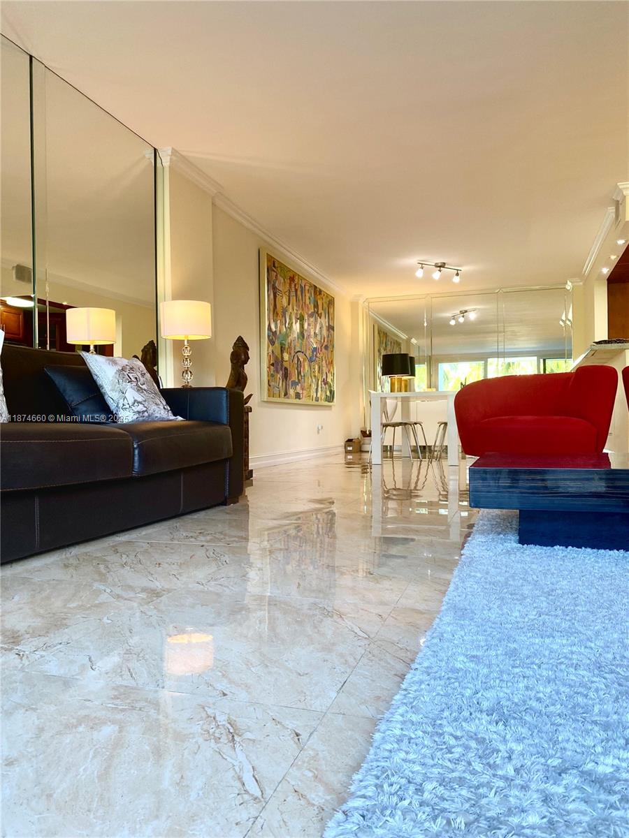 177 Ocean Ln Drive, Unit 212 Key Biscayne, FL 33149 - Photo 5 of 20 a living room with furniture and a couch