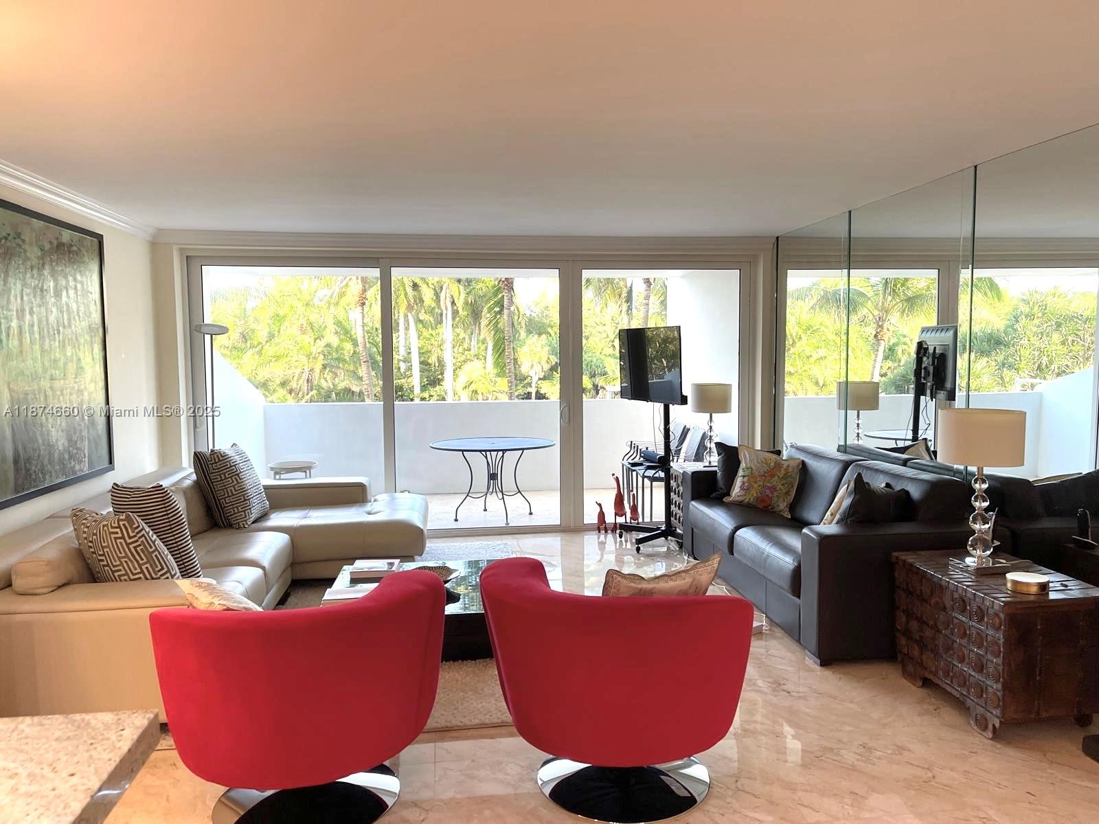 177 Ocean Ln Drive, Unit 212 Key Biscayne, FL 33149 - Photo 7 of 20 a living room with furniture and a large window