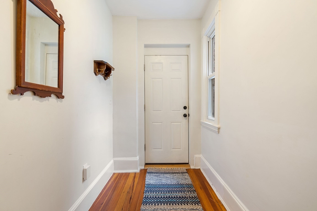 23 Goethe Street, Unit 1 Boston, MA 02132 - Photo 13 of 19 a view of a room with a wardrobe