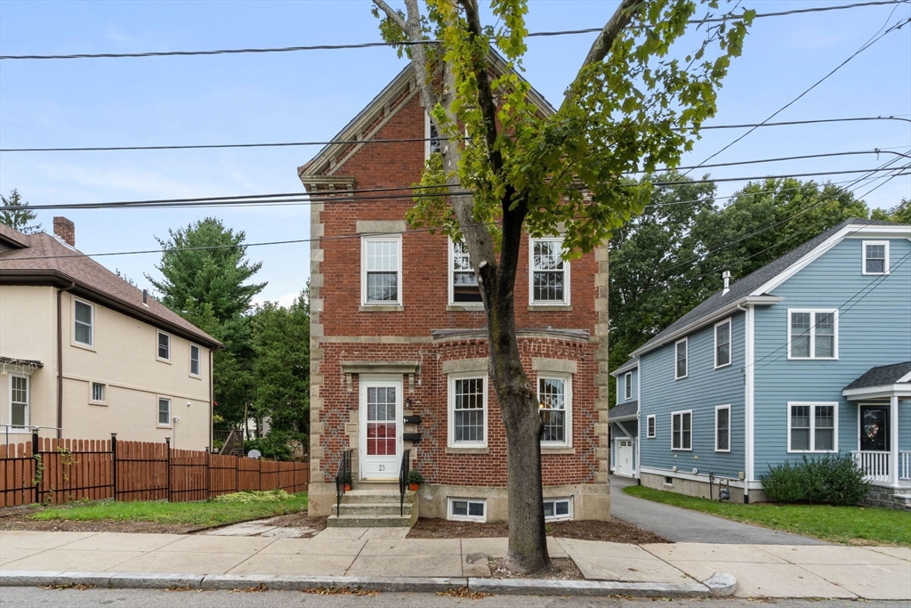 23 Goethe Street, Unit 1 Boston, MA 02132 - Photo 16 of 19 a front view of a house with a yard