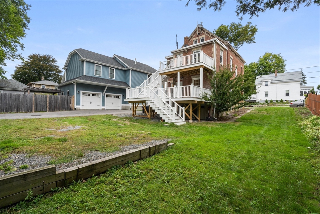 23 Goethe Street, Unit 1 Boston, MA 02132 - Photo 17 of 19 a view of a house with a yard porch and sitting area