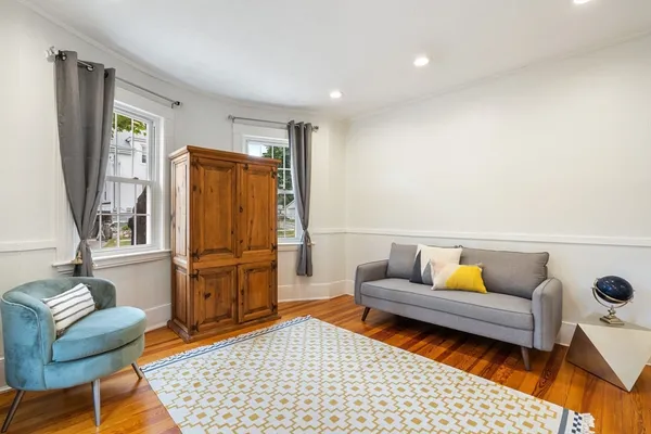 a living room with furniture and a rug