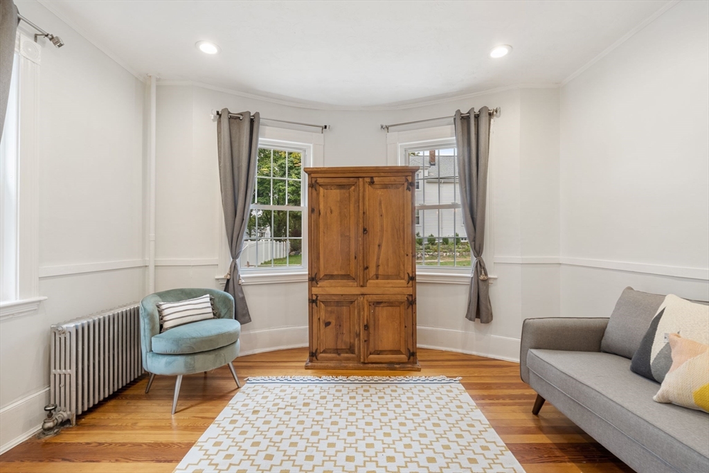 23 Goethe Street, Unit 1 Boston, MA 02132 - Photo 6 of 19 a living room with furniture and a rug