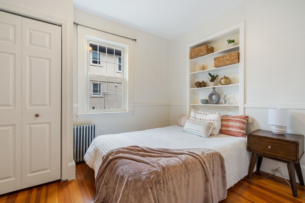 23 Goethe Street, Unit 1 Boston, MA 02132 - Photo 10 of 19 a bedroom with a bed and a window