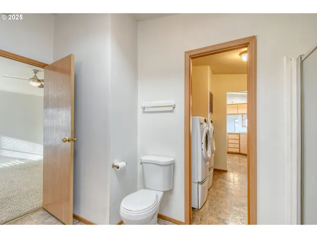 a bathroom with a granite countertop sink mirror and vanity