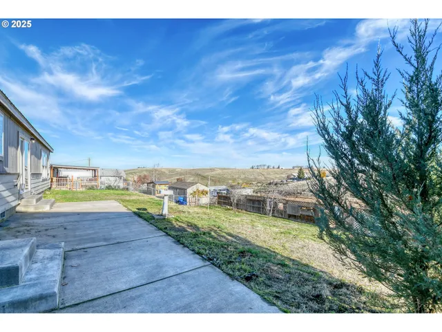 a backyard of a house with seating space