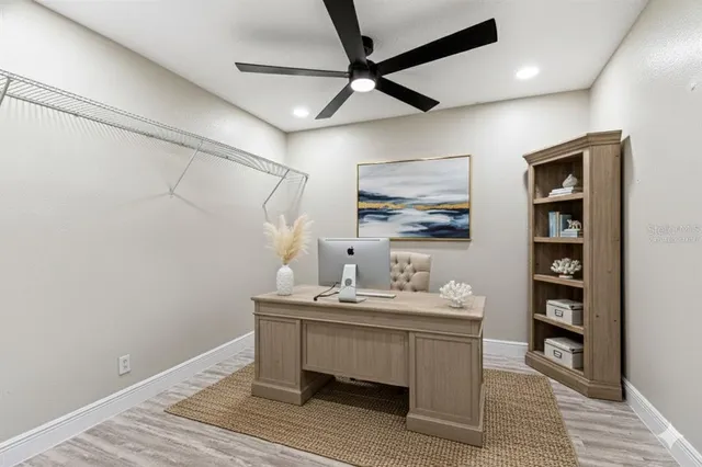 a workspace with furniture and window