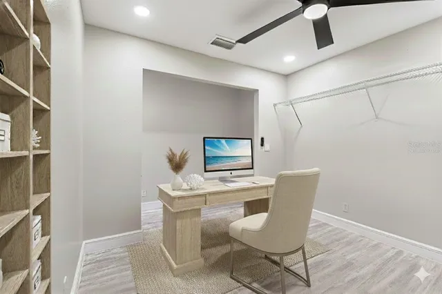 a workspace with furniture and wooden floor