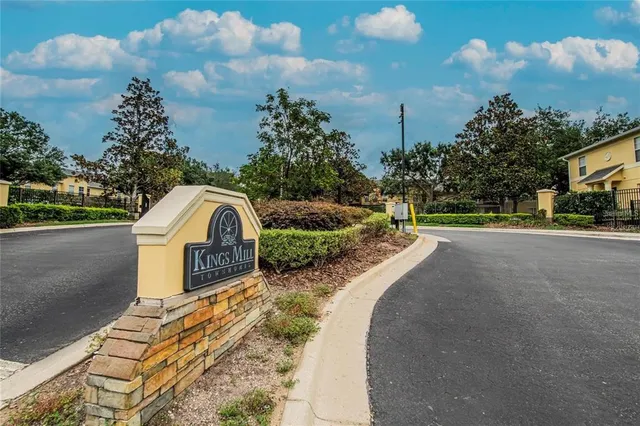 a view of a street with a building in the background