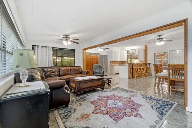 a living room with furniture and a rug