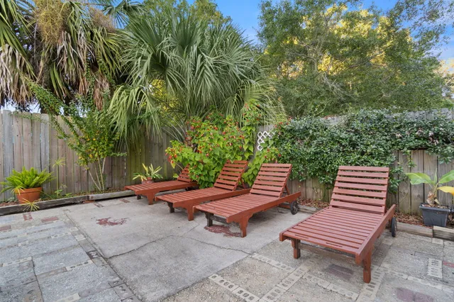 a view of a backyard with sitting area