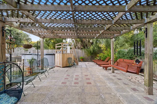 a view of a backyard with sitting area