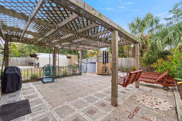 a view of a chairs and table in the patio