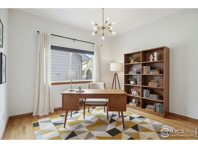 a workspace with furniture and window