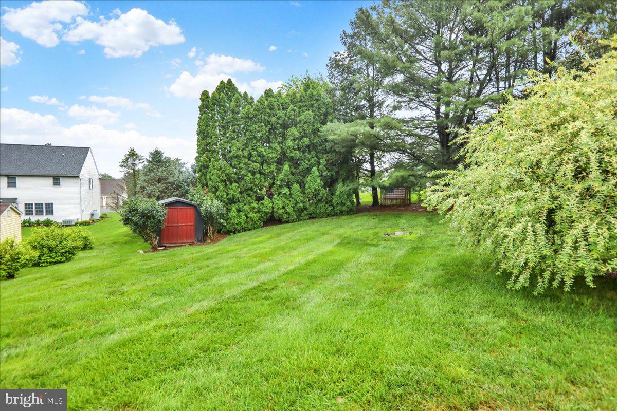 828 Pine Hill Road Lititz, PA 17543 - Photo 35 of 37 a backyard of a house with lots of green space