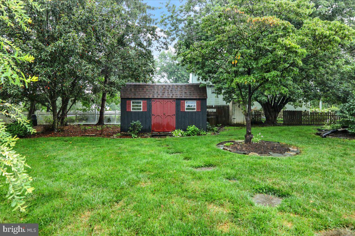 828 Pine Hill Road Lititz, PA 17543 - Photo 36 of 37 a front view of a house with garden and trees