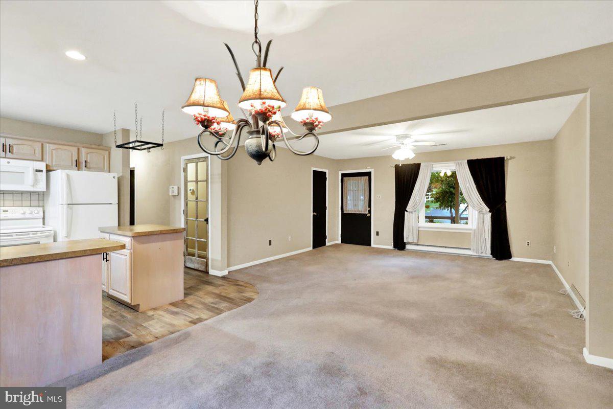 828 Pine Hill Road Lititz, PA 17543 - Photo 5 of 37 a view of a room with a window and chandelier
