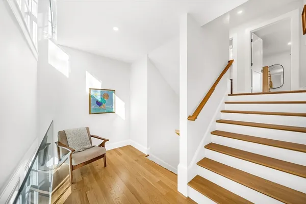 a view of a hallway with seating area