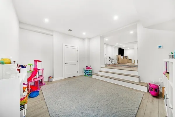 a bedroom with furniture and toys