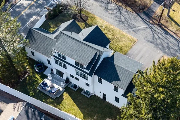 an aerial view of house with yard