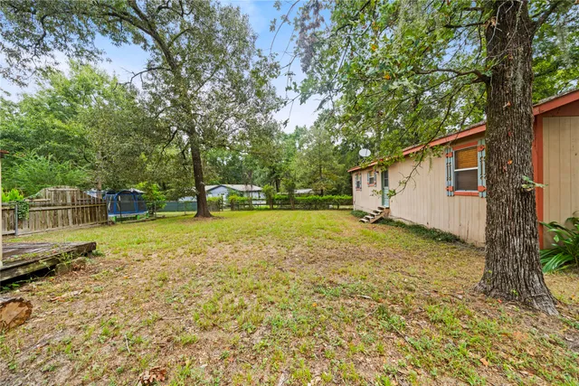 a view of a yard with a house and garden