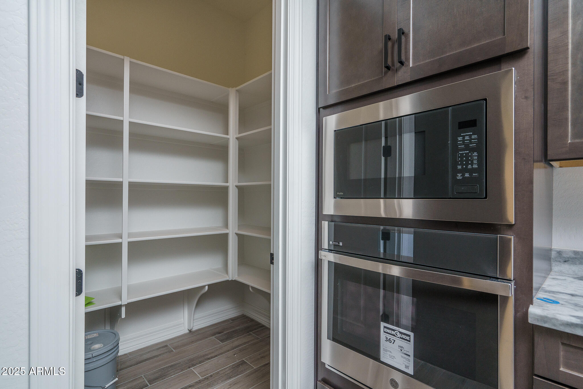 18575 West Sapium Way Goodyear, AZ 85338 - Photo 13 of 51 a view of walk in closet with empty racks