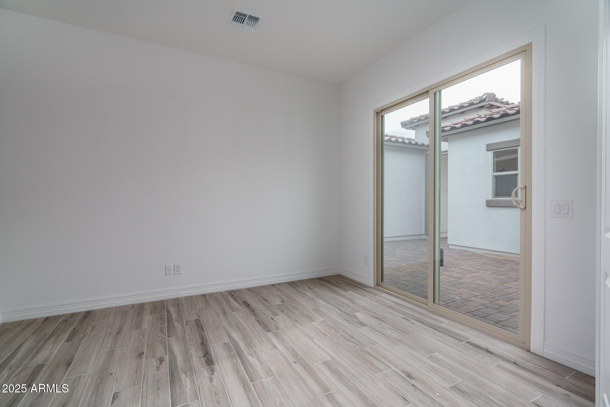 18575 West Sapium Way Goodyear, AZ 85338 - Photo 14 of 51 wooden floor in an empty room