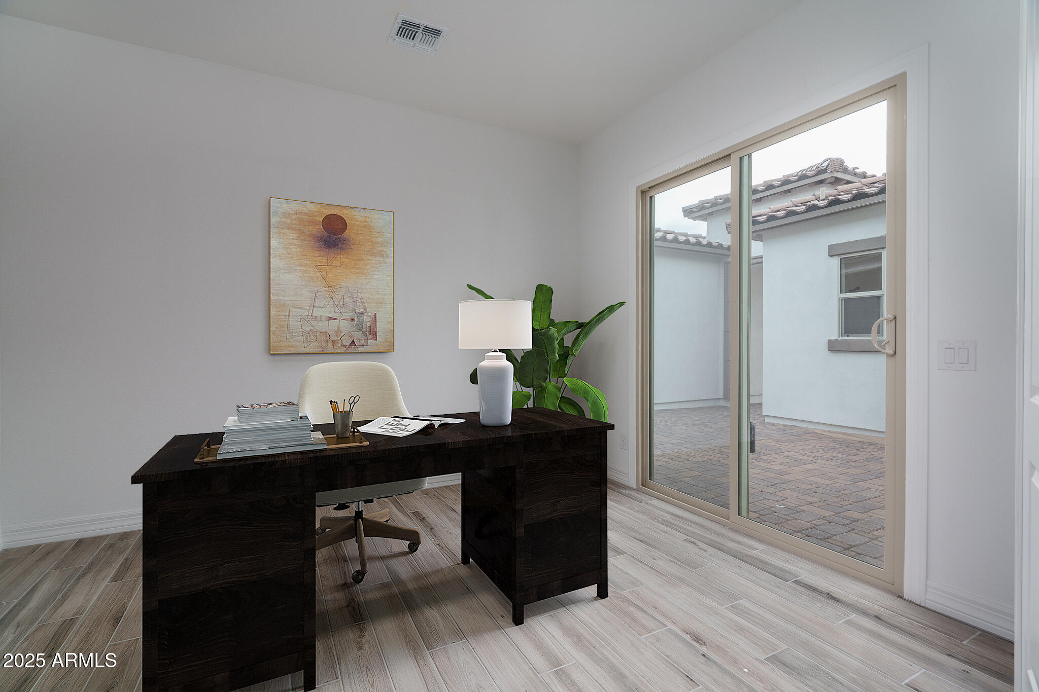 18575 West Sapium Way Goodyear, AZ 85338 - Photo 15 of 51 a room with a table and chairs in it