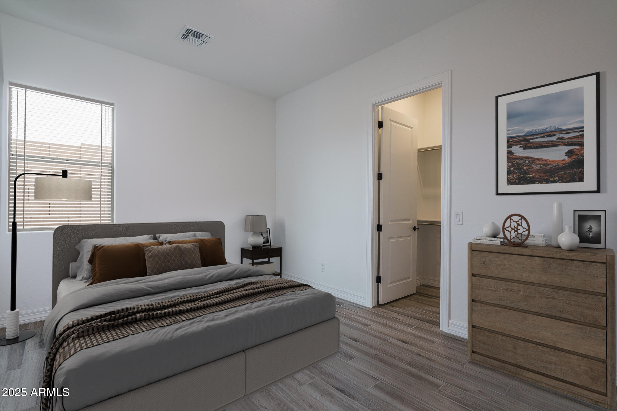 18575 West Sapium Way Goodyear, AZ 85338 - Photo 22 of 51 a bedroom with a bed and cabinet