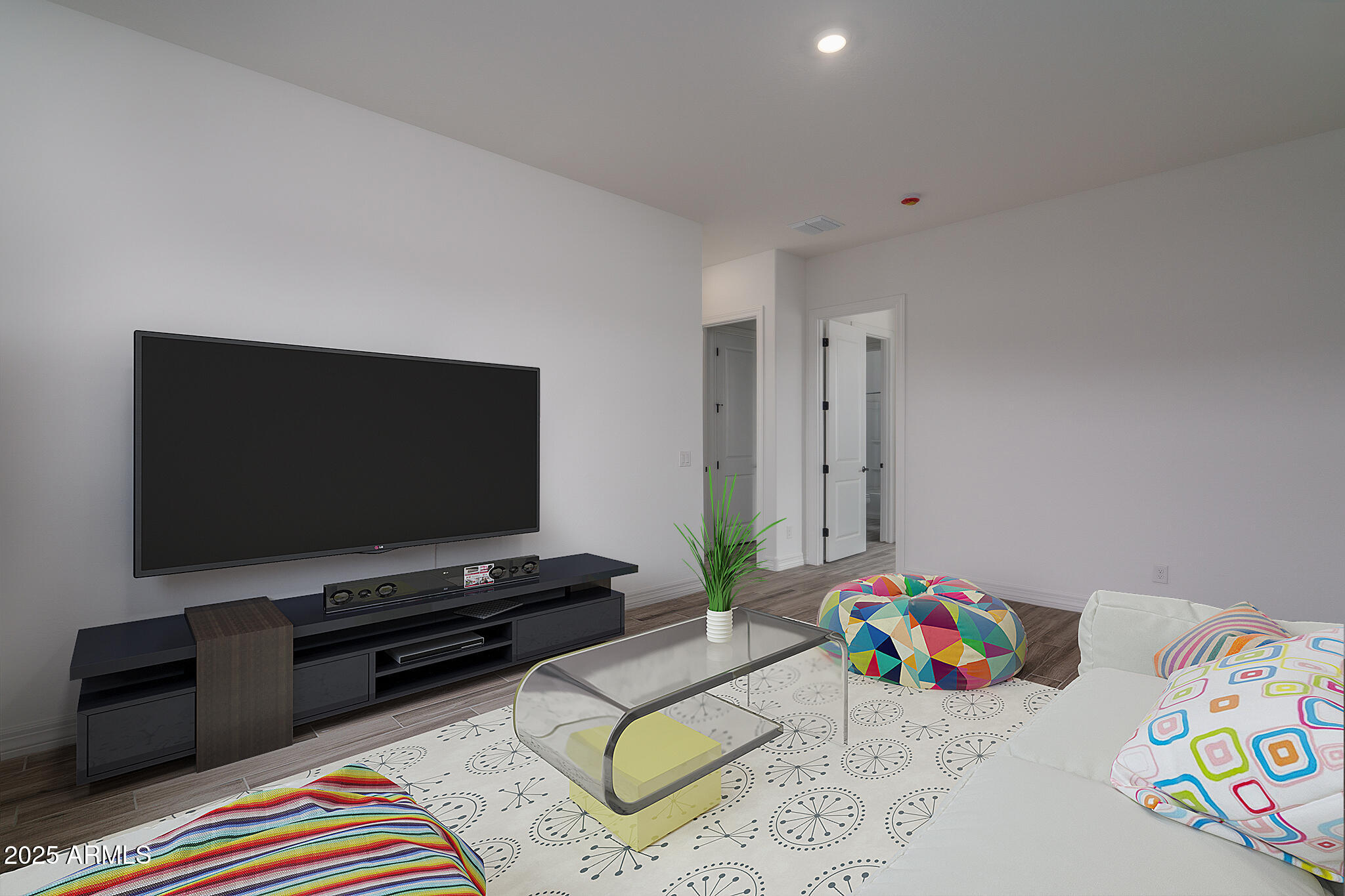 18575 West Sapium Way Goodyear, AZ 85338 - Photo 32 of 51 a bedroom with furniture and a flat screen tv