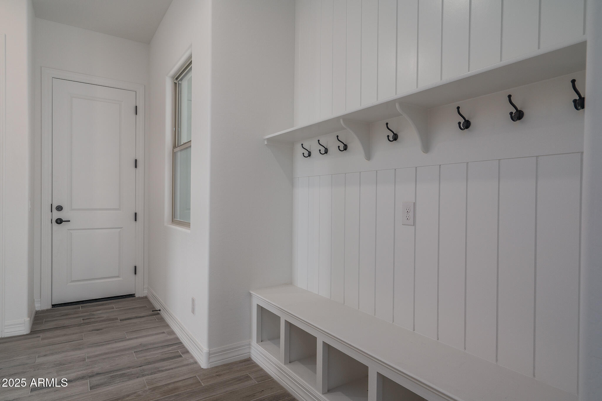 18575 West Sapium Way Goodyear, AZ 85338 - Photo 33 of 51 a view of an entryway with wooden floor