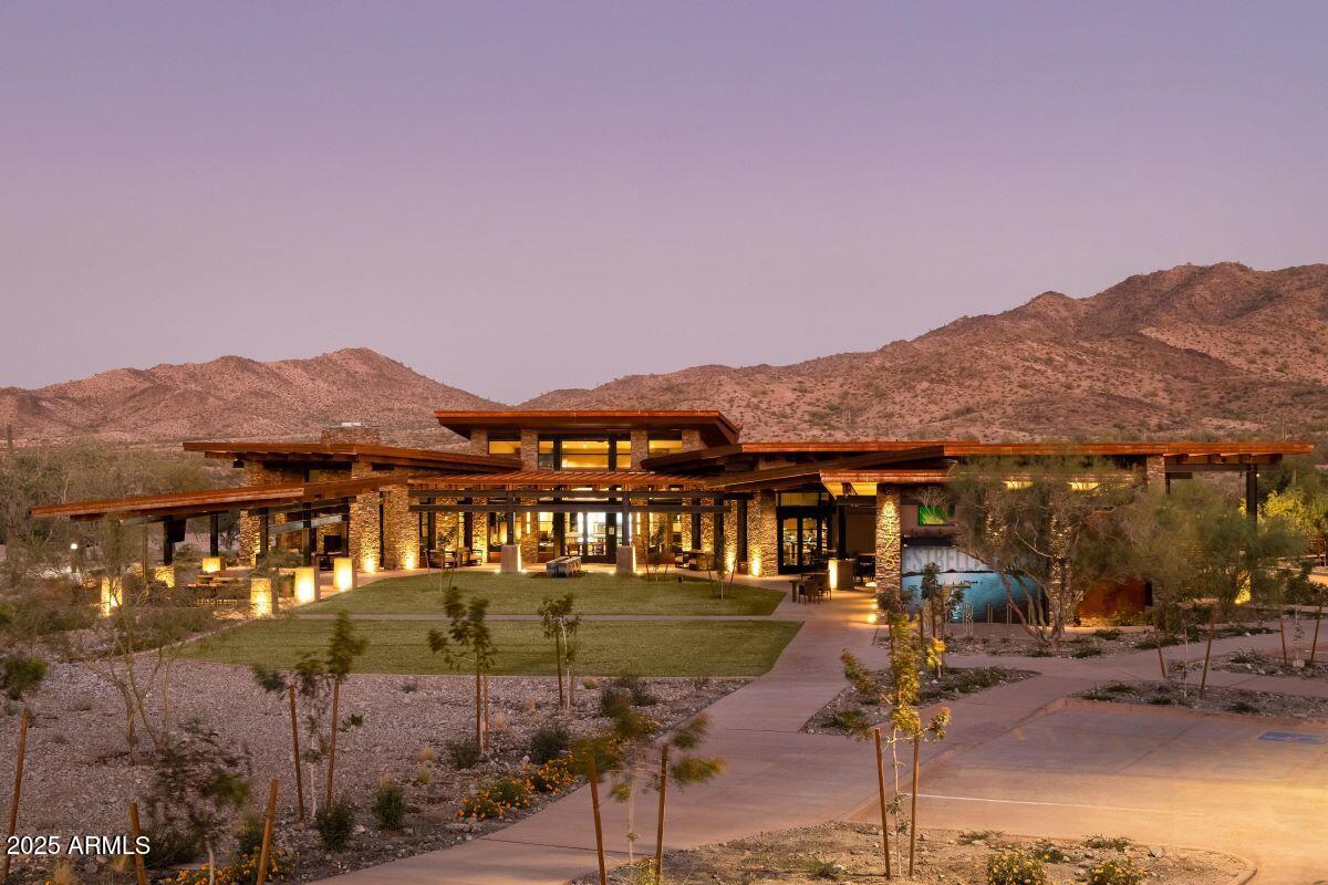 18575 West Sapium Way Goodyear, AZ 85338 - Photo 40 of 51 a front view of a house with a yard and mountain view
