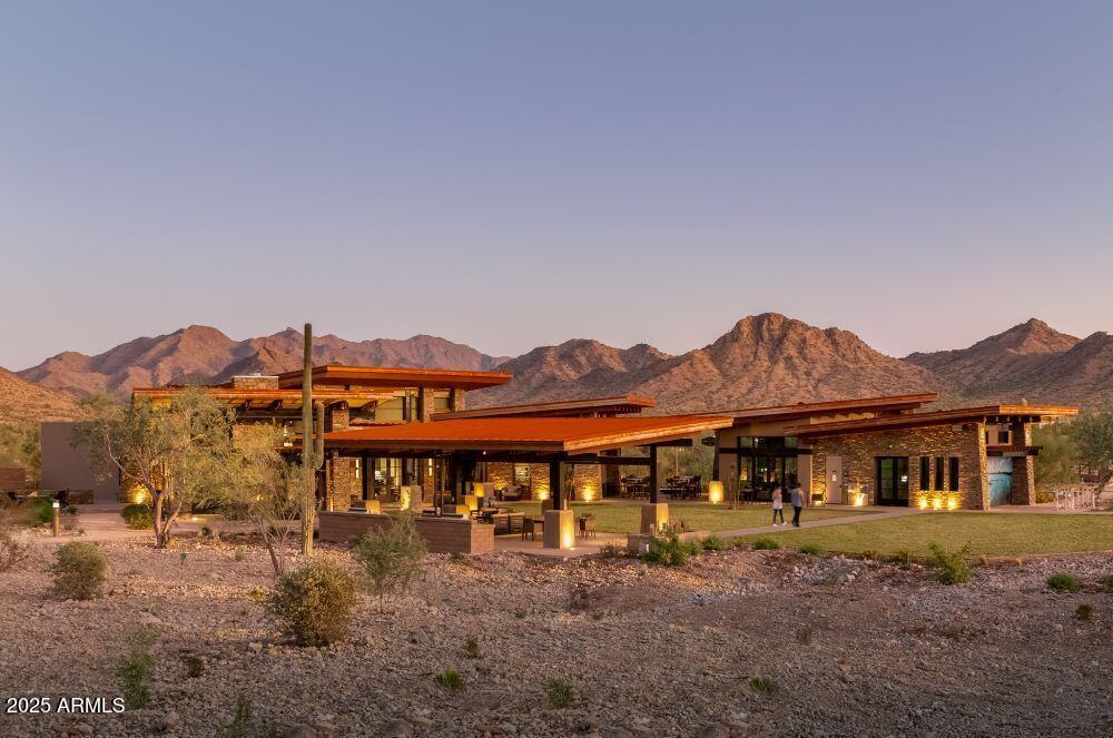 18575 West Sapium Way Goodyear, AZ 85338 - Photo 41 of 51 a front view of a house with a yard and mountain view