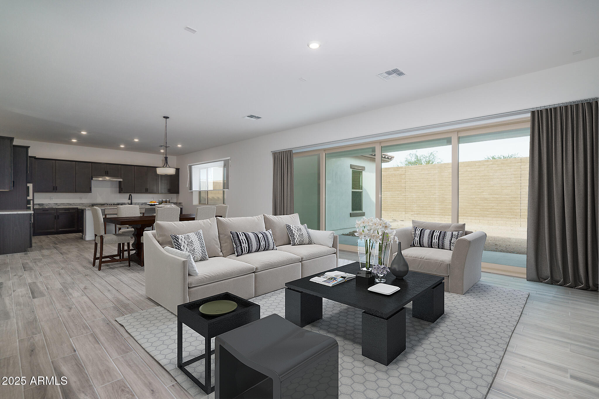 18575 West Sapium Way Goodyear, AZ 85338 - Photo 6 of 51 a living room with furniture and a table