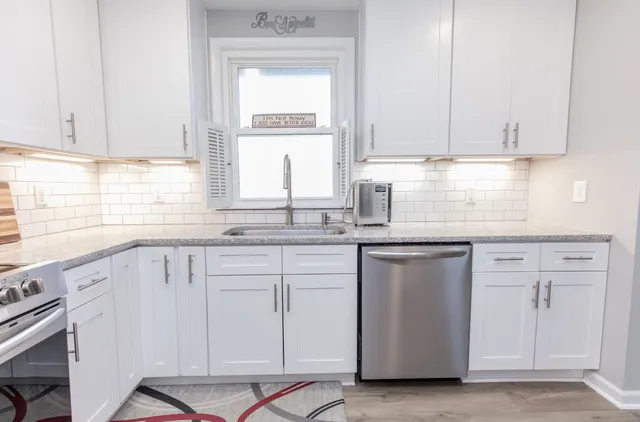 a kitchen with a refrigerator stove and microwave