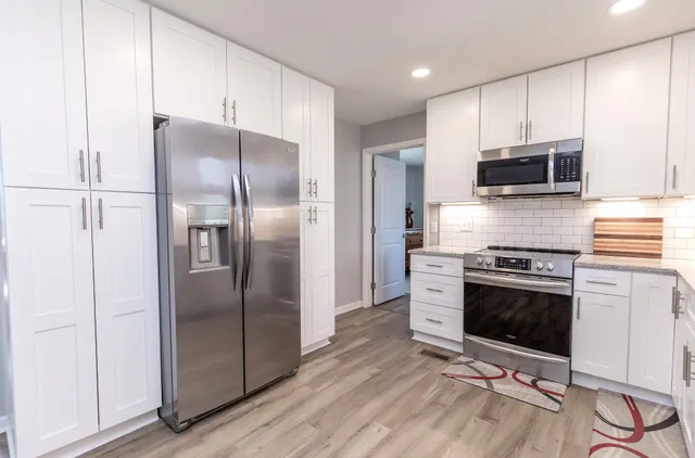 a view of livingroom with hardwood floor and hallway