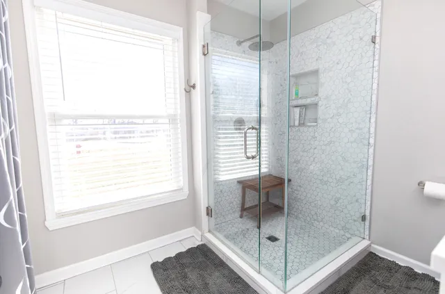 a backyard of a house with wooden fence