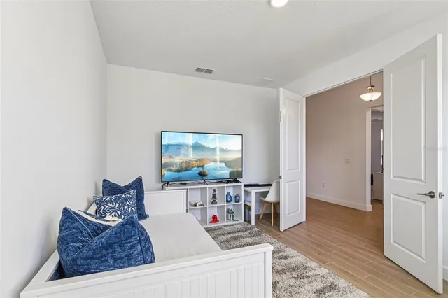 a bathroom with a sink a toilet a shower and a mirror