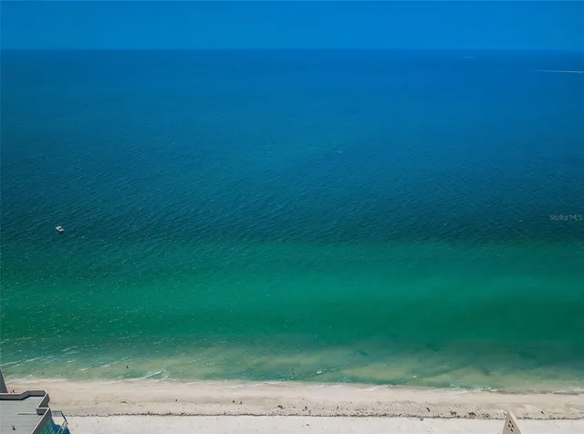 a bathroom with 2 sink tub and a mirror