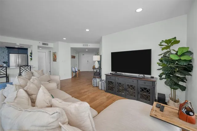 a view of a room with gym equipment and a large window