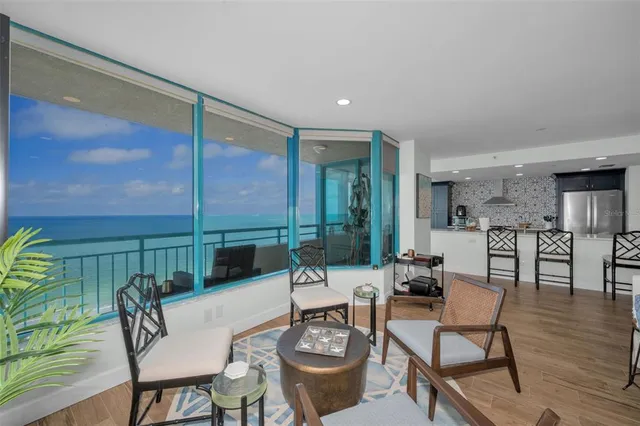 a view of a tennis ground with large trees