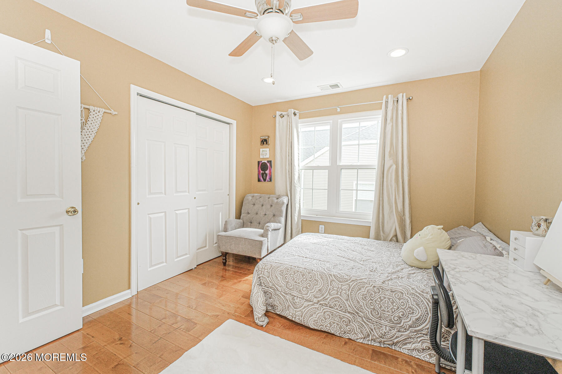 315 Wedgewood Road Morganville, NJ 07751 - Photo 28 of 37 a bedroom with a bed and a chandelier
