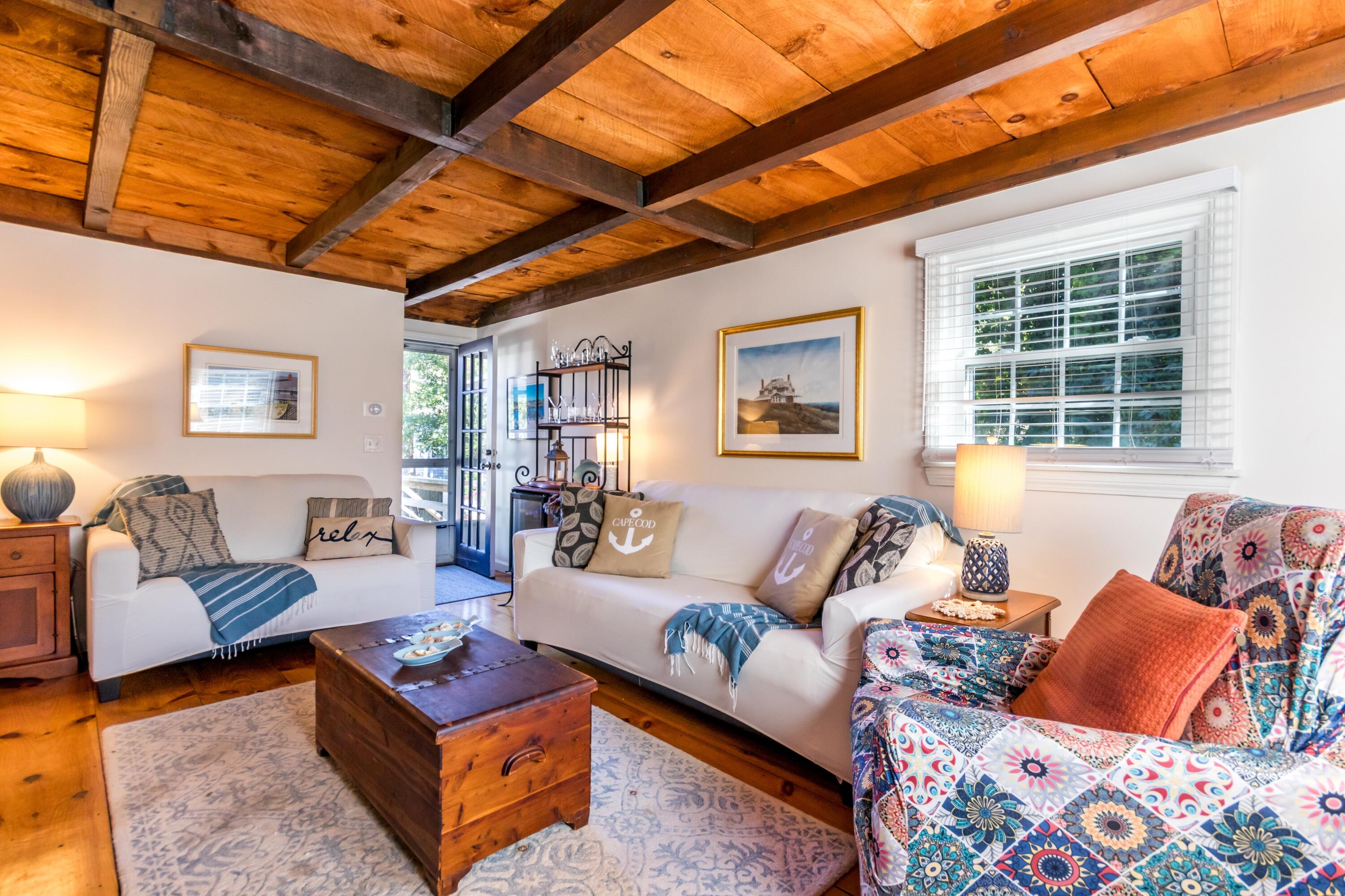 42 Agnes Road South Dennis, MA 02660 - Photo 13 of 36 a living room with furniture and a large window