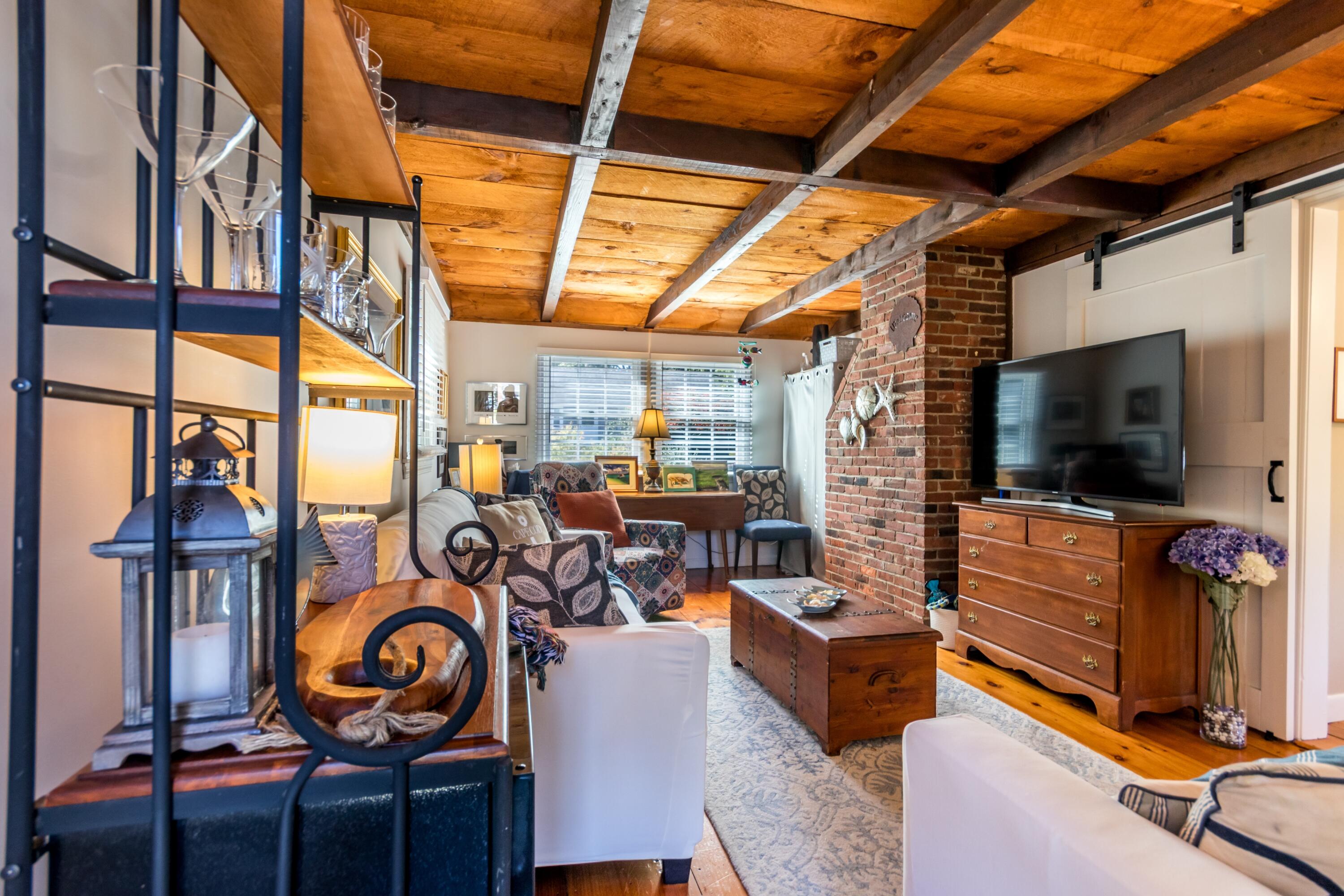 42 Agnes Road South Dennis, MA 02660 - Photo 15 of 36 a living room with furniture and a flat screen tv