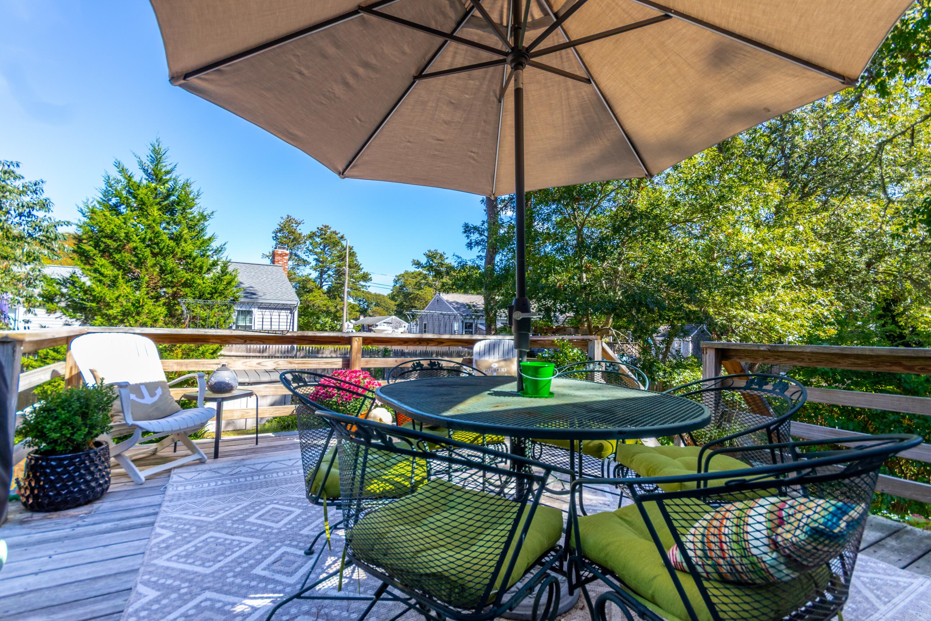 42 Agnes Road South Dennis, MA 02660 - Photo 2 of 36 an outdoor space with furniture and umbrella